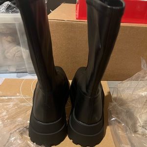 Brand new soft leather boots with zippers in front